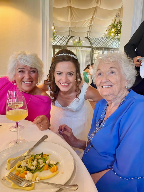Vicky (Jay’s mum), Filly, and Grandma around the table at lunch, smiling at the camera.