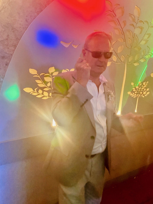 Peter with sunglasses on the dancefloor looking cool.