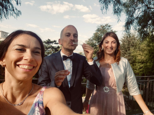 Daniella, Marco, and Vivienna, blowing celebratory bubbles in the venue ground.