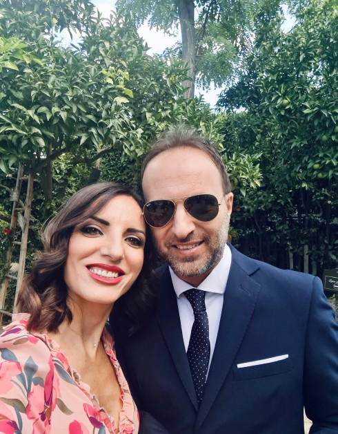Fernanda and Renato (wearing sunglasses) in the venue gardens.