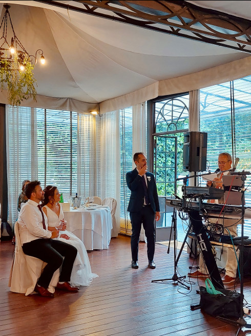 Peter, Jay's dad, making a speech while Jay, Filly, and Ricky look on.
