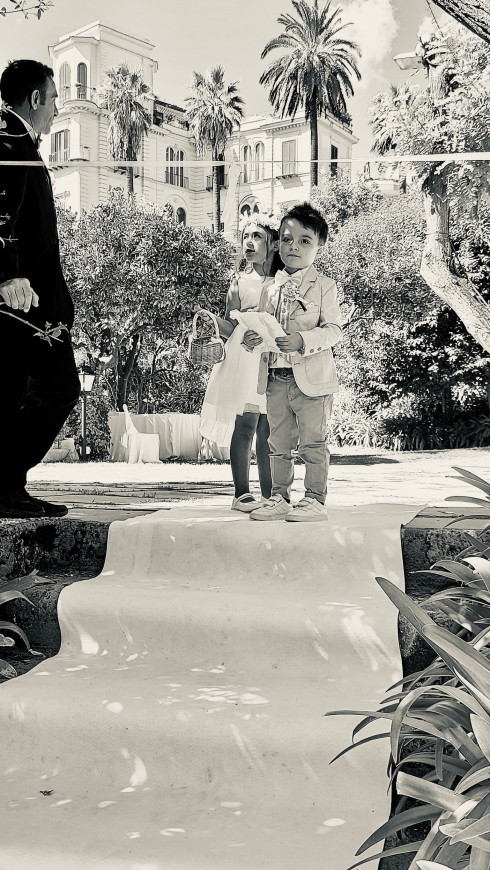 Chiara and Valentino stood at the top of the steps waiting to perform their roles.