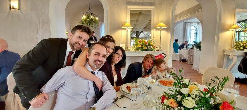 Guests sat around a dining table, with baby Emma eating spaghetti.