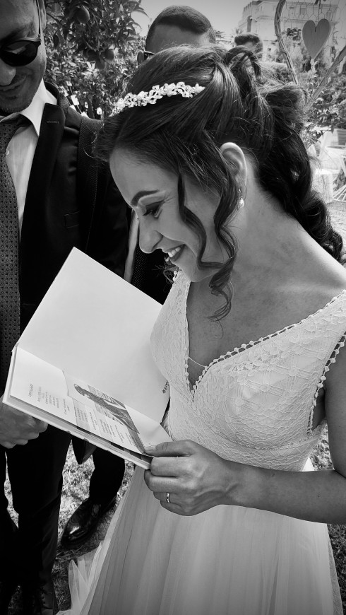Filly reading the note from her friends in the book they gave her.