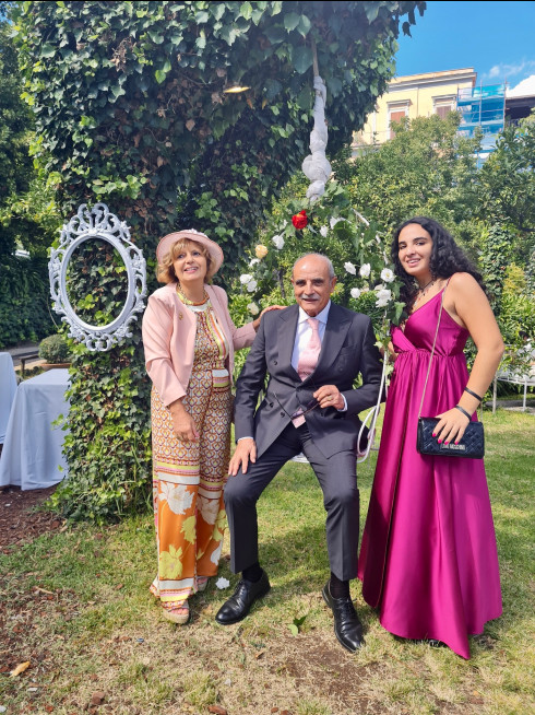Concetta and Angelo, Filly's aunt and uncle, with Chiara, their niece. Angelo is sat in a swinging chair.