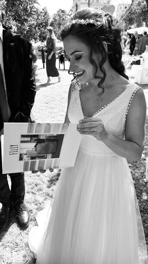 Filly looking through a book of photos her friends made her.