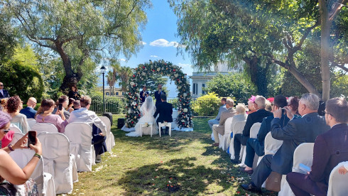 Jay and Filly sat at the front of the flower arch while Ricky MCs.