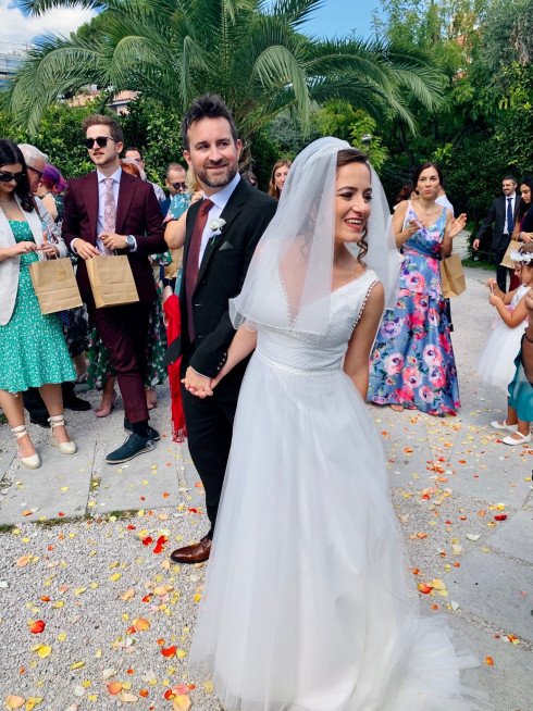 Jay and Filly standing amongst the wedding confetti.