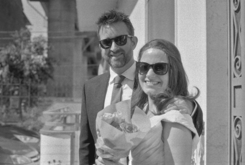 Jay and Filly on the steps of Filly's family house in Marigliano, with Filly holding some flowers.