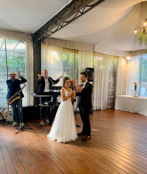 Filly and Jay clapping before their first dance.