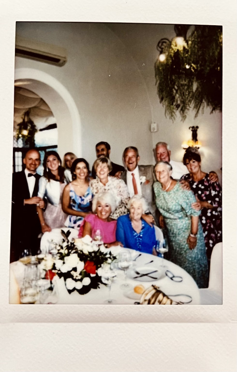 12 people surrounding a table, a mixture of British and Italians.